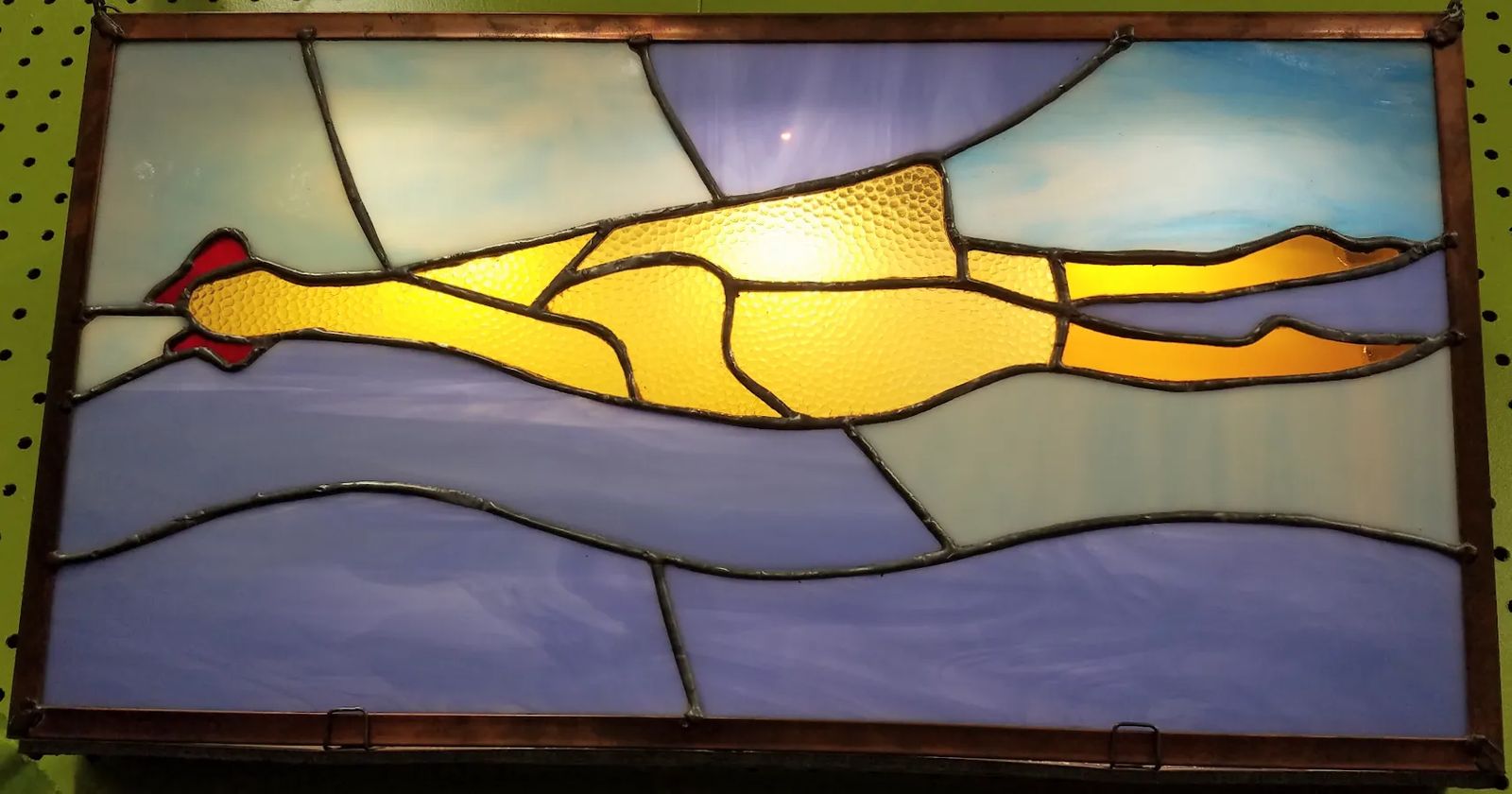 A Photo A stained-glass representation of a rubber chicken in Archie McPhee's world-famous rubber chicken museum in Seattle, Washington