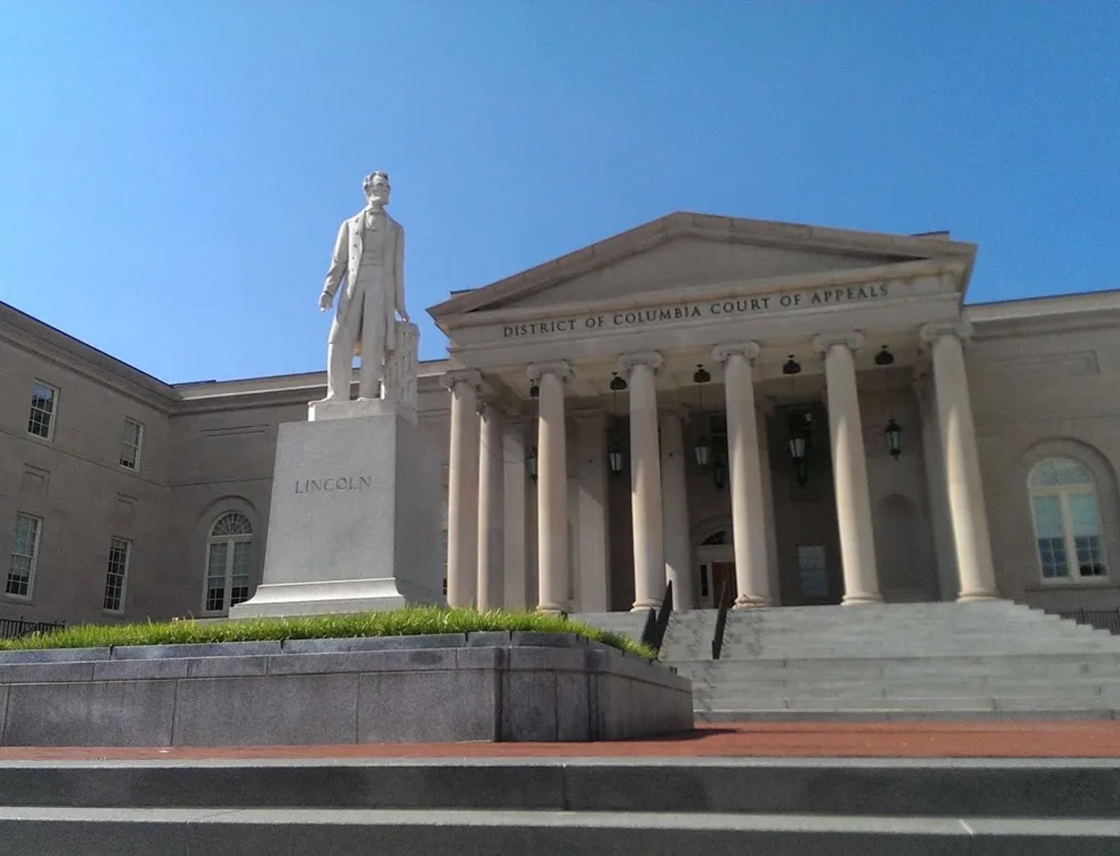 Photo of The statue of Abraham Lincoln, standing in front of the DC Court of Appeals