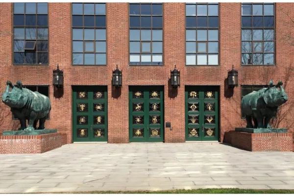 Photo of Two life-size Indian Rhinoceros statues that guard the doors to the School of Cellular and Molecular Biology, at Harvard University, in Boston, Massachusetts