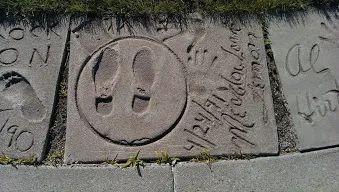 Photo of Meadowlark Lemon shoe and hand prints in cement, in Fargo, North Dakota