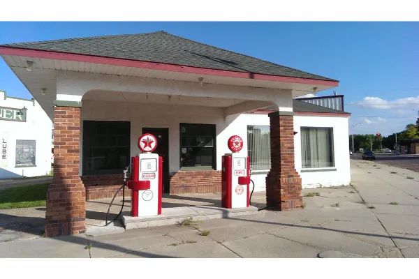 Photo of two antique gas pumps, one for Ethyl and one for Regular, in St. Paul, Nebraska