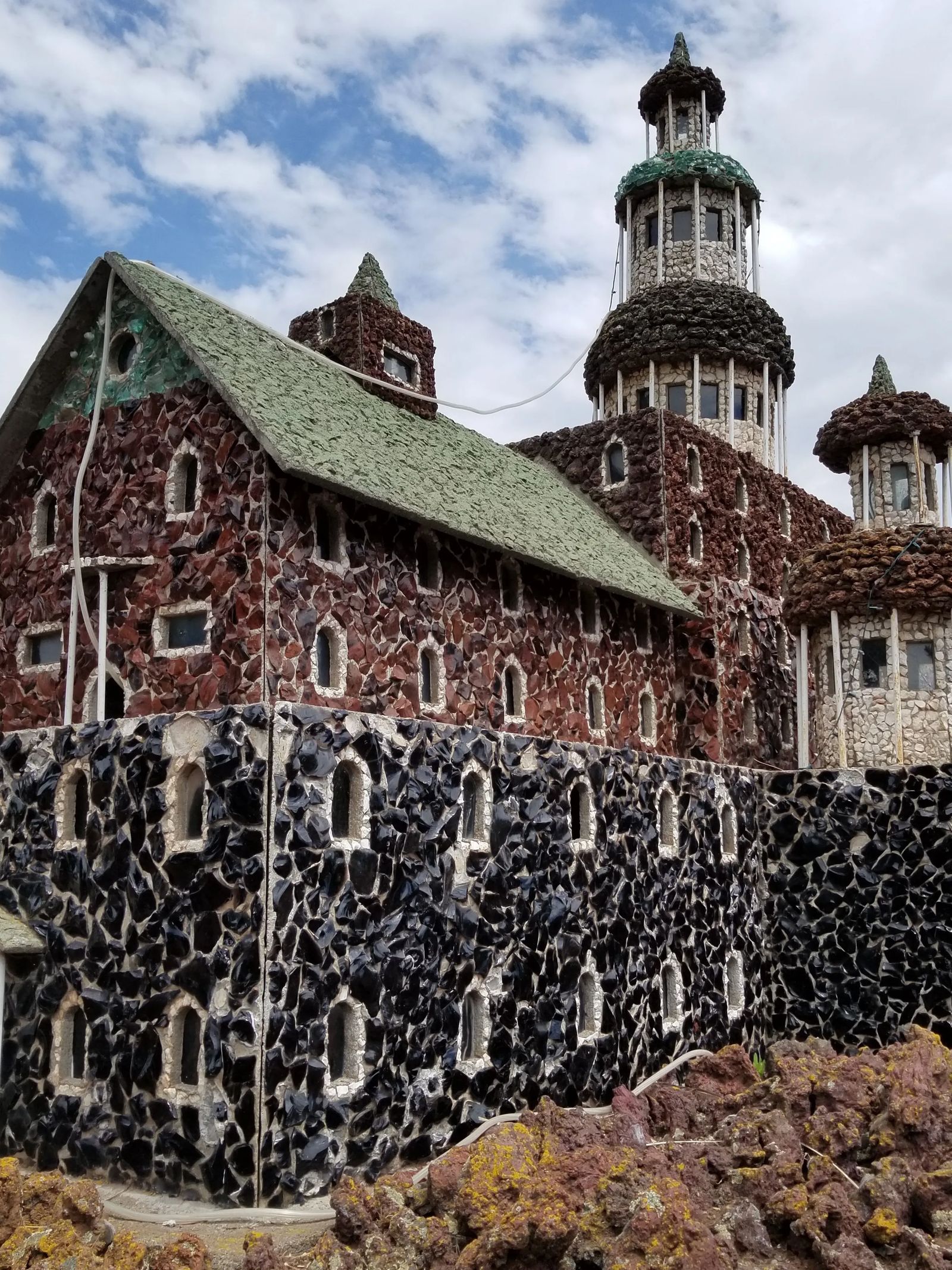 Photo of rock house built by Rasmus Petersen in Oregon