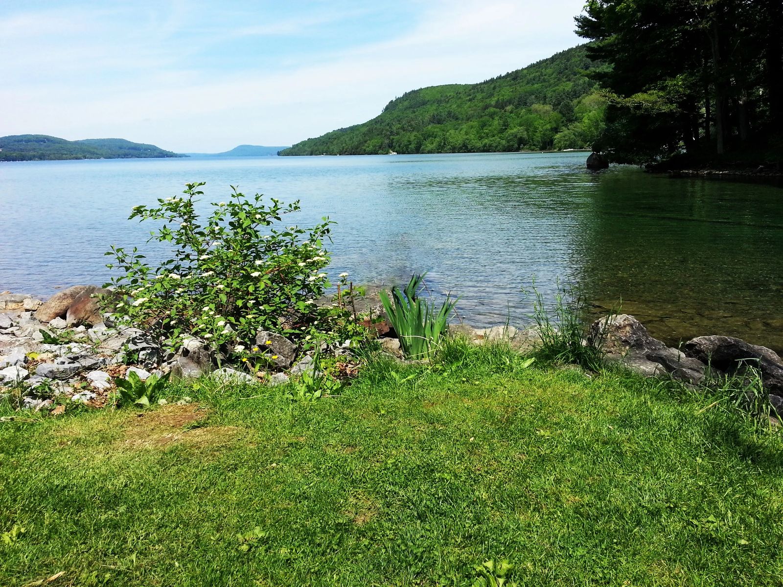 Photo of Susqueshanna River headwaters where it flows out of Lake Otsego, in Cooperstown, New York