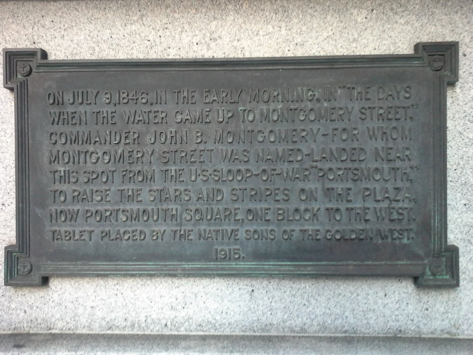 Photo of a plaque that marks the original shoreline location in San Francisco, California, where Captain John B. Montgomery of the US sloop-of-war "Portsmouth," came ashore to plant the U.S. flag. July 9, 1846.