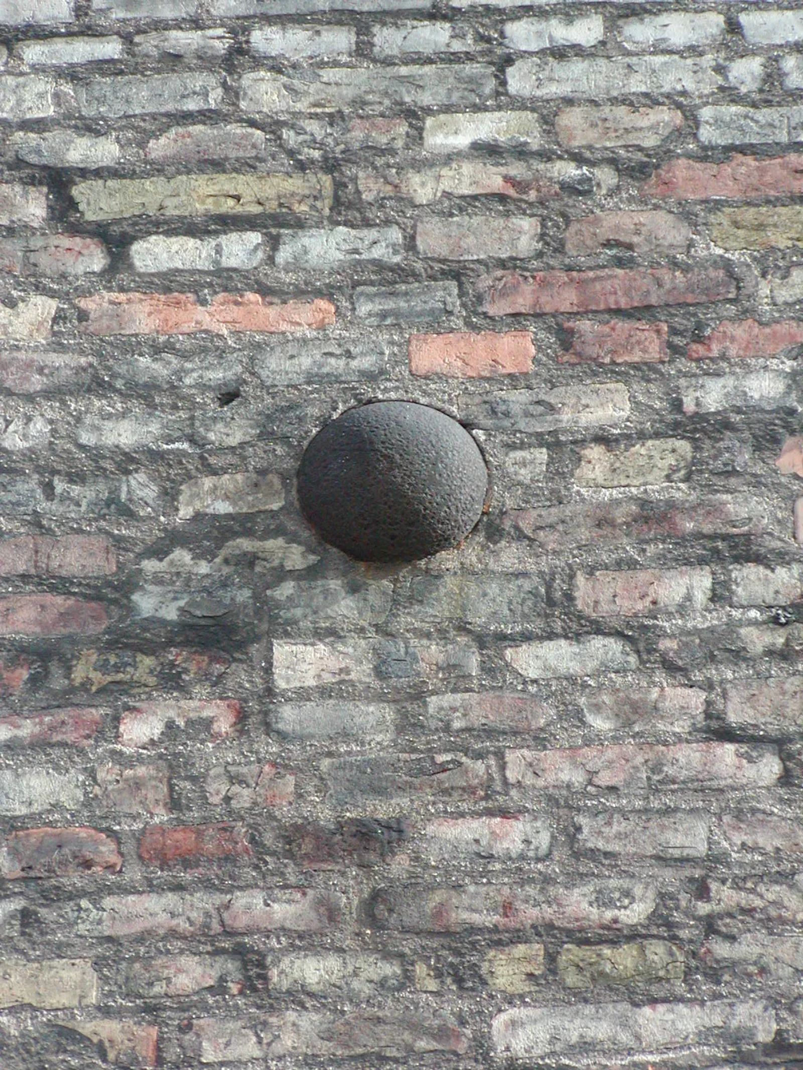 Photo of Cannonball lodged in the wall of a building in Copenhagen, Denmark