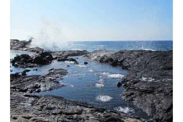 Photo of volcanic rocks and the ocean in Hawaii
