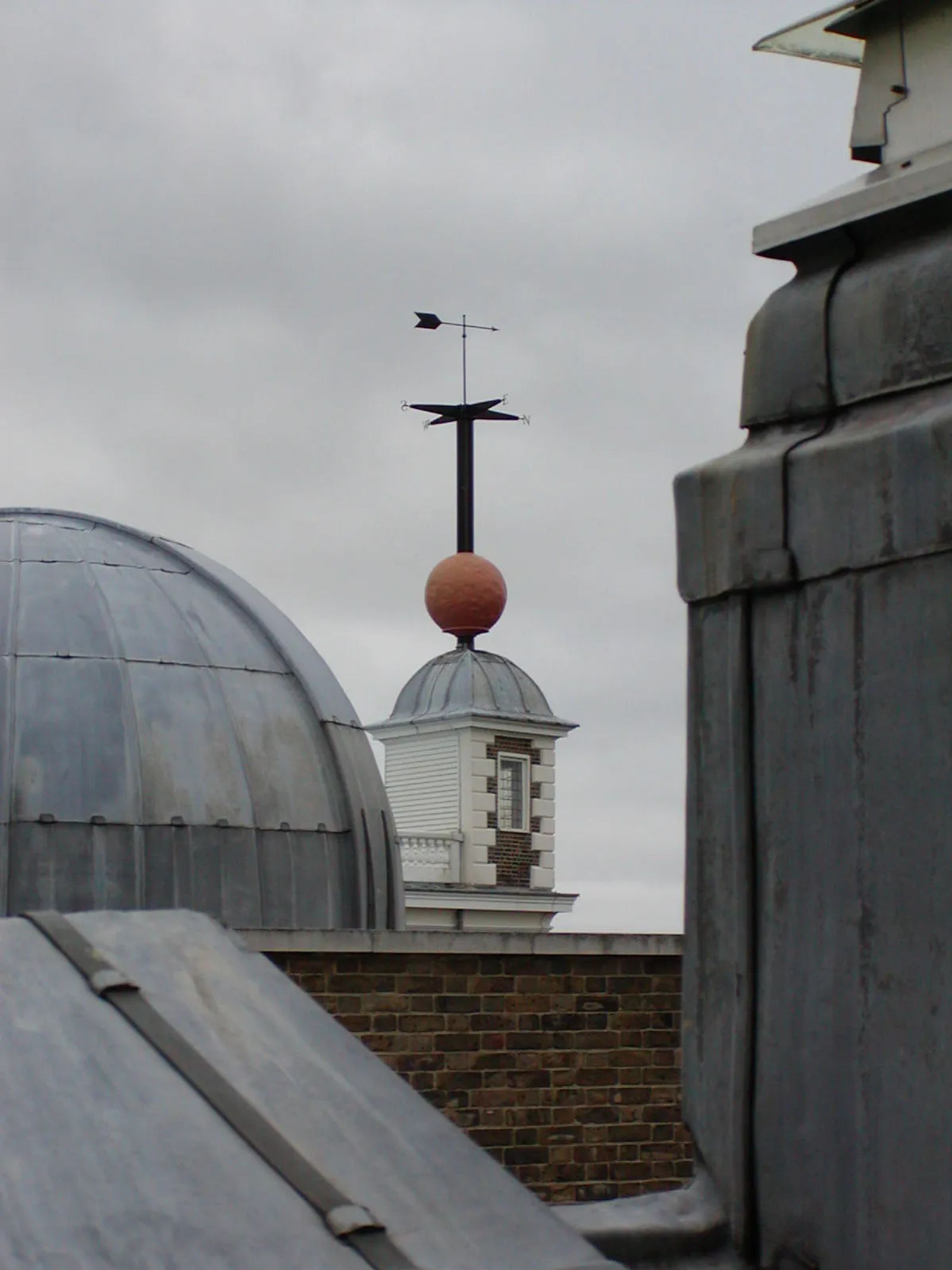 Photo of the red ball atop the Flamsteed House in Greenwich, England