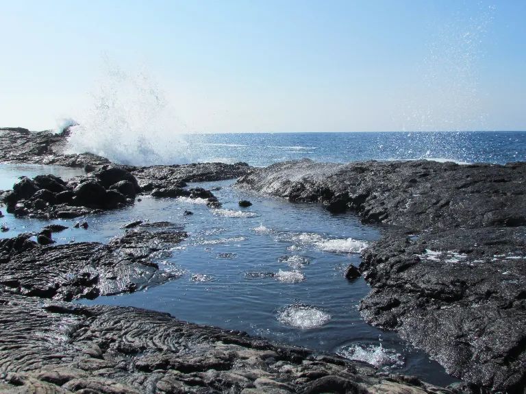 Photo of volcanic rocks and the ocean in Hawaii