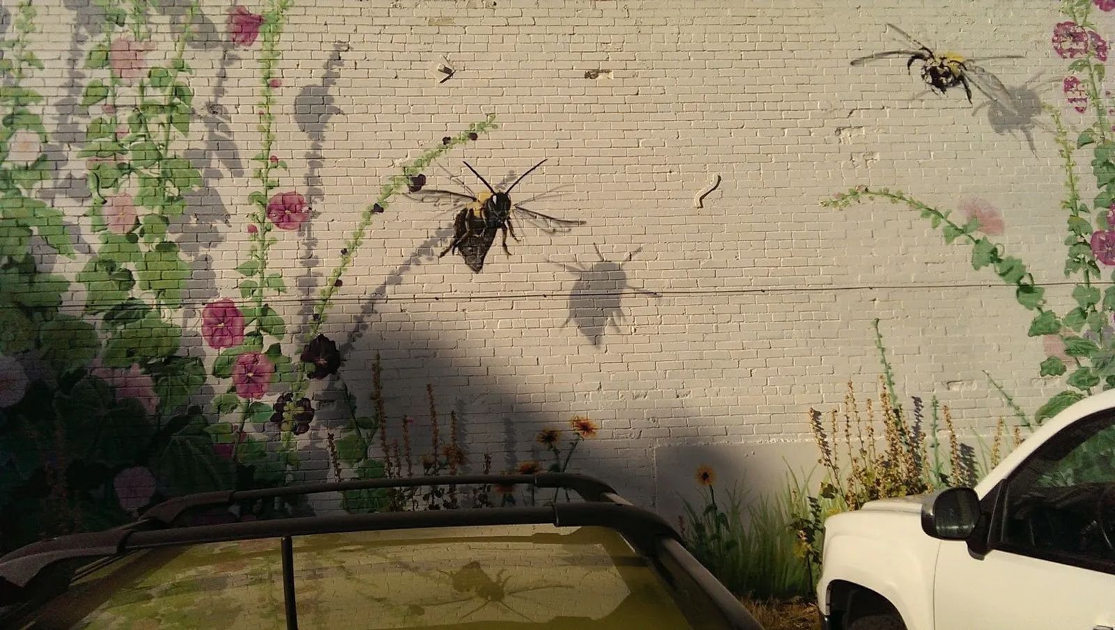 Photo of The "Hollyhock Haven" mural in Laramie, Wyoming