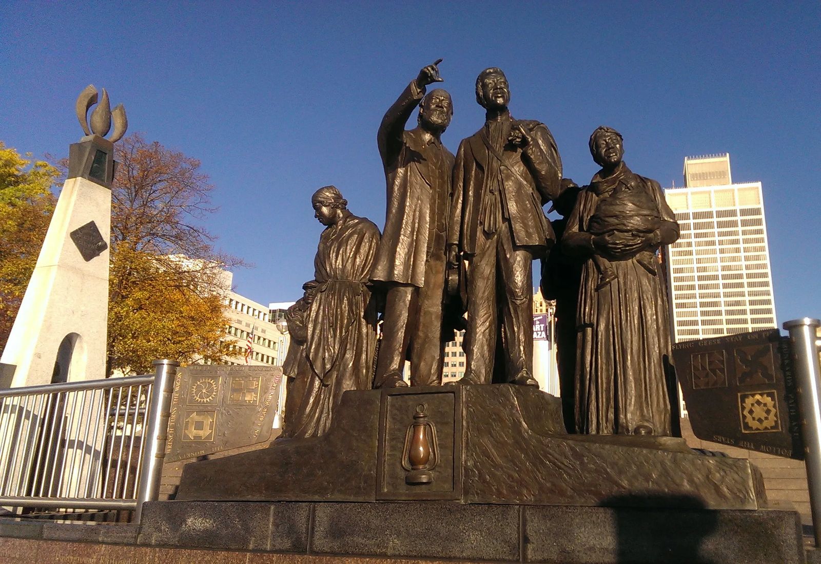 Photo of Statue of an extended family of slaves getting ready to cross to the south side of the Detroit River, to Canada and freedom, in Detroit, Michigan